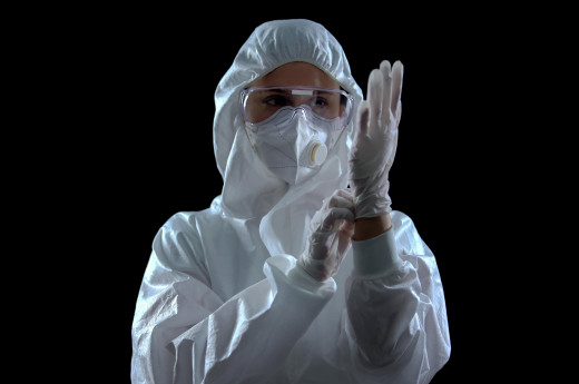 a person wearing white hazmat suit