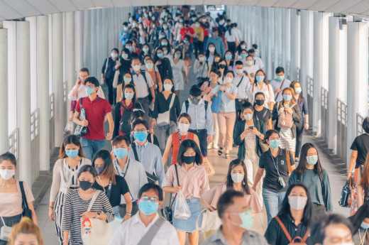 People walking in group wearing masks