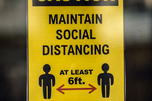 Banner of caution to maintain social distancing of at least 6 M