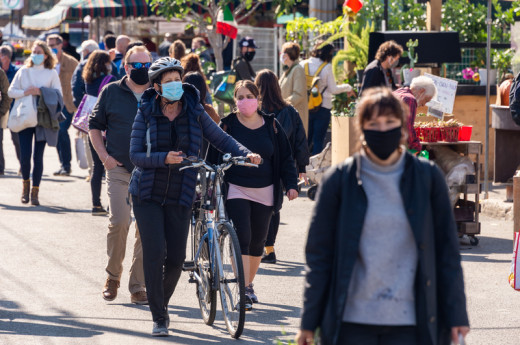 People walking on street wearing masks