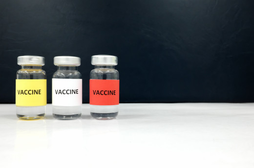 Multiple colors vaccine vials with copy space. Coronavirus Covid-19 vaccine candidate concept