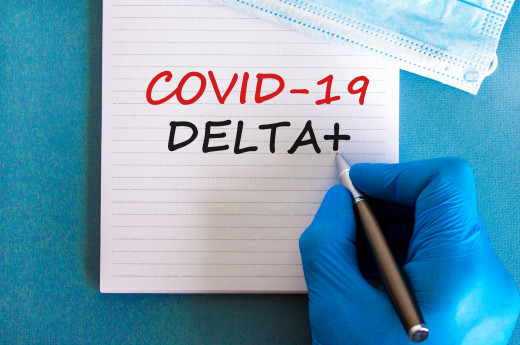 Covid 19 Delta variant stain symbol, hand in blue gloves, white card concept words
