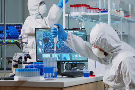 Scientists wearing PPE in laboratory