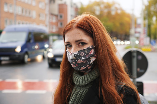 A woman wearing clothes mask