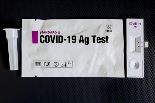 A Rapid Antigen Test For Covid-19 Coronavirus Contagion Control And Its Packaging With Special Diluent On A Black Background